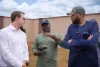 UN Volunteer, Dennis Bwala (center) speaks to representatives from the German Ministry of Foreign Affairs during a donor visit to the 152 houses built by UNDP in Jibia for the internally displaced persons. 