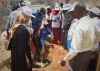 UNAMID UN Volunteer Abu Bakarr Bangura instructs youth group members from an Internally Displaced Person camp in Darfur on techniques for small scale composting