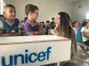 Rasha Abou Dargham with Syrian refugee children in a UNICEF-supported classroom in Baharka Camp, Iraq.