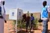 South Sudanese refugees washing their hands at a UNHCR facility during a registration exercise in South Darfur. Prior to the registration, UNHCR conducted a sensitization session about COVID-19, which included handwashing techniques.