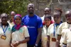 UN Volunteer Blasio Amoche Omulama, Monitoring and Evaluation Specialist (WFP) with the ‘Rescue Divas Women’s VSLA Group’ in Isiolo County, Kenya.