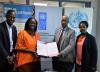 UNV Country Coordinator Moses Mubiru (left) at the signing of a secondment agreement for UN Volunteers to support the Ebola response. Next to him are UNDP Resident Representative Ms Elsie Attafua, WHO Representative Dr Yonas Tegegn Woldemariam and UNDP Deputy Representative Ms Sheila Ngatia (from left to right).