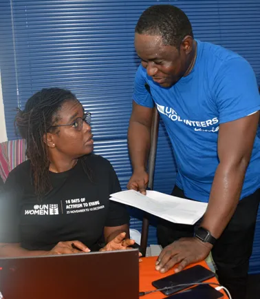 UN Volunteer Abraham V. Kanneh with a colleague in Liberia.
